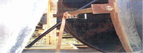 How the pipe was secured on the reel using a ratchet strap