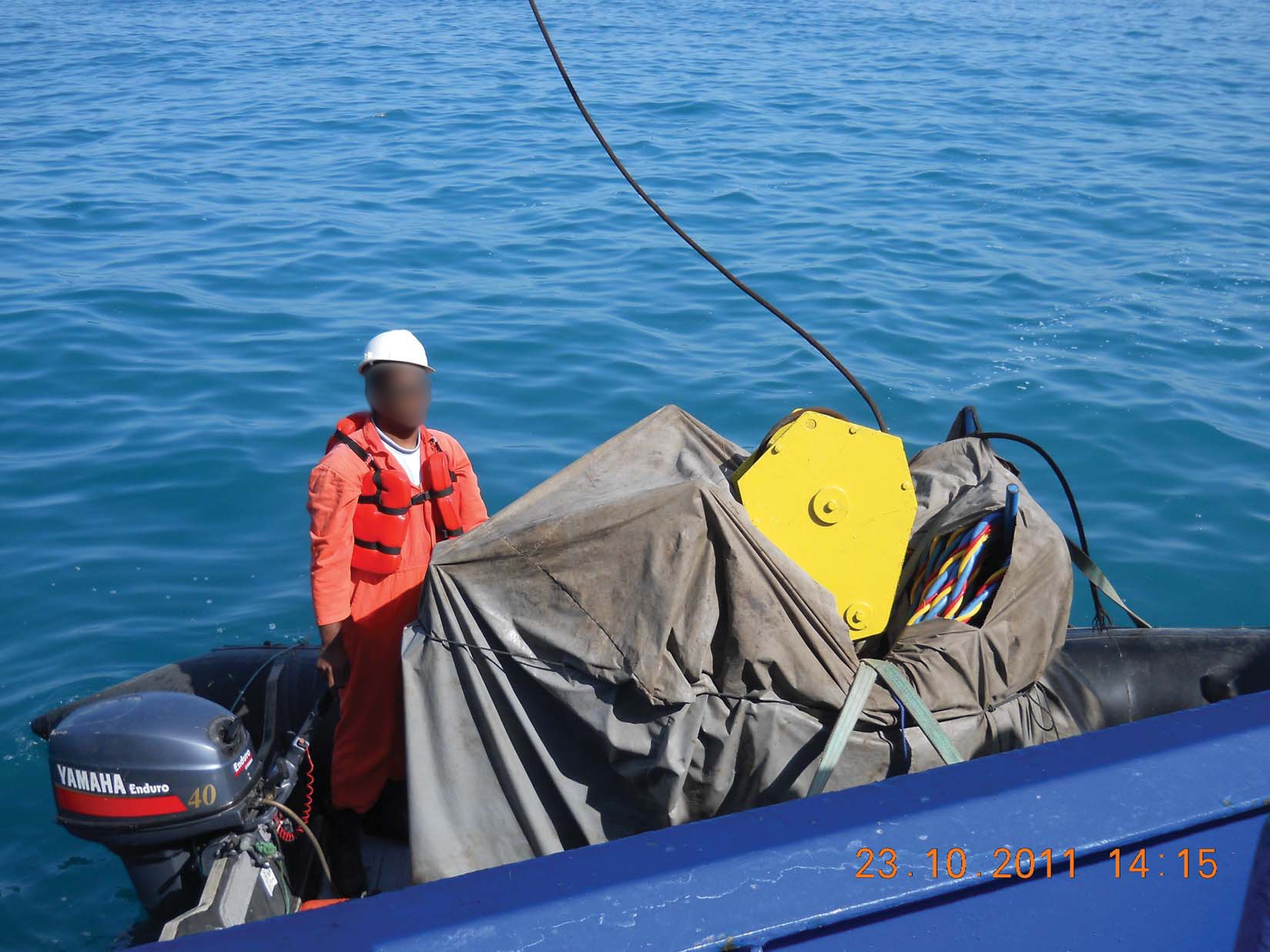 Crane block landed in small boat