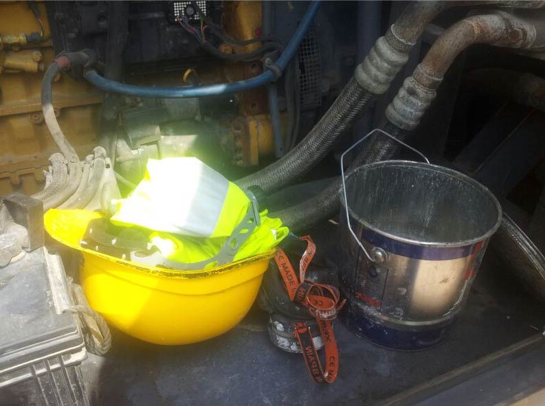 Compressor unit with PPE and flammable materials inappropriately stored inside