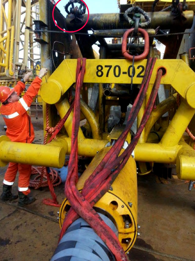 Damaged pipeline end termination (PLET) after the explosion (note blackened areas in red circle, and CEM sensor array in foreground)