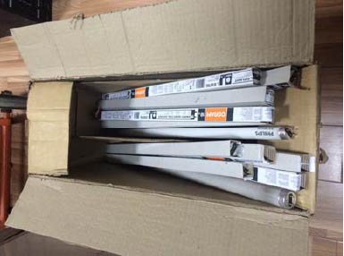 Open box with fluorescent tubes