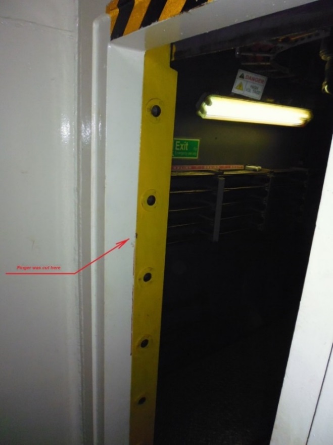 Watertight sliding door in the fully 'open' position (red arrow indicating the pinch area)