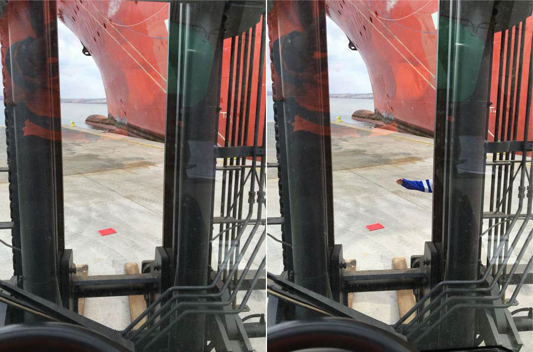 A mock-up showing the forklift operator's field of view, as impaired by the forklift mast. The two pictures demonstrate how a person can easily be concealed behind the forklift mast and missed by the operator. The picture on the left demonstrates the person fully hidden and the picture on the right demonstrates the person extending his arm to reveal his position